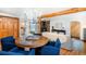 Comfortable open-plan living area, featuring a dining table and a stone fireplace at 20951 Pleasant Park Rd, Conifer, CO 80433