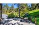 Outdoor patio and dining area features lush natural surroundings at 20951 Pleasant Park Rd, Conifer, CO 80433