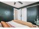 Bedroom with barn door entry and calming decor at 1280 Macon St, Aurora, CO 80010