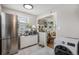 Updated kitchen with stainless steel appliances and green cabinets at 1280 Macon St, Aurora, CO 80010