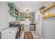 Eat-in kitchen with farmhouse sink and ample storage at 1280 Macon St, Aurora, CO 80010