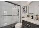 Modern bathroom with a mosaic tile shower and black hardware, exemplifying contemporary design and style at 8356 W 87Th Dr # A, Arvada, CO 80005