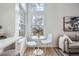 Cozy sitting area with a breakfast nook table near large windows and hardwood style floors at 8356 W 87Th Dr # A, Arvada, CO 80005