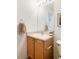 Simple bathroom with wood vanity and updated fixtures at 5255 Memphis St # 822, Denver, CO 80239