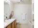 Clean bathroom with a double vanity, bathtub and shower at 5255 Memphis St # 822, Denver, CO 80239