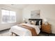 Bright bedroom with large window, neutral tones, and ample natural light at 5255 Memphis St # 822, Denver, CO 80239