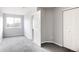 Bright bedroom featuring gray carpeting and ample closet space at 5255 Memphis St # 822, Denver, CO 80239