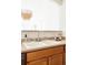 Modern kitchen sink with chrome faucet and light wood cabinets at 5255 Memphis St # 822, Denver, CO 80239