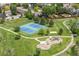 Aerial view of community park with tennis courts, playground, and walking paths in a Gathering-friendly neighborhood at 10802 W Indore Dr, Littleton, CO 80127