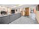 Bright basement featuring a large couch and TV at 10802 W Indore Dr, Littleton, CO 80127