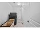 Clean, well-lit laundry room with modern appliances, storage, and patterned flooring at 10802 W Indore Dr, Littleton, CO 80127