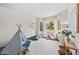 Bright playroom with a tent, cozy seating, and large windows for natural light at 10802 W Indore Dr, Littleton, CO 80127