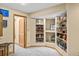 Finished storage room with built-in shelves, offering ample space for decor and collectibles at 10802 W Indore Dr, Littleton, CO 80127