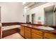 Bathroom featuring a soaking tub, tile countertops, and a skylight providing natural light at 9400 E Iliff Ave # 88, Denver, CO 80231