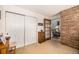 Bedroom view with white closet doors and access to another room, showcasing spaciousness at 9400 E Iliff Ave # 88, Denver, CO 80231