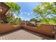 Exterior view of a private deck surrounded by mature trees offering privacy and an outdoor space for relaxation at 9400 E Iliff Ave # 88, Denver, CO 80231