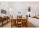 Charming dining room featuring a wooden table set, complemented by nautical decor and natural light at 9400 E Iliff Ave # 88, Denver, CO 80231