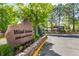 Wind Stream community signage with lush flowerbeds and greenery in a tranquil setting at 9400 E Iliff Ave # 88, Denver, CO 80231