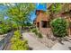 Well-manicured landscaping enhances this home's curb appeal, with a stone pathway leading to the front entrance at 9400 E Iliff Ave # 88, Denver, CO 80231
