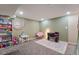 Finished basement featuring neutral walls, grey carpet, play and office areas at 5809 S Pearl St, Centennial, CO 80121