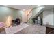 Finished basement with stairs, neutral walls, grey carpet and an office area at 5809 S Pearl St, Centennial, CO 80121