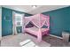 Pink-themed bedroom with ample natural light from the window and a colorful area rug at 5809 S Pearl St, Centennial, CO 80121