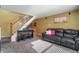 A spacious living room features stairs, carpet, and natural light at 5809 S Pearl St, Centennial, CO 80121