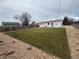 Spacious backyard featuring well-maintained lawn and new patio at 9120 Judson St, Westminster, CO 80031