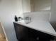 Stylish bathroom featuring a dark vanity with white countertops and modern fixtures at 9120 Judson St, Westminster, CO 80031