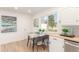 Bright dining area features a marble table, modern decor and a large window with natural light at 9120 Judson St, Westminster, CO 80031