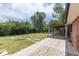 Large backyard with covered deck and fire pit offers outdoor entertaining at 6176 Ammons St, Arvada, CO 80004
