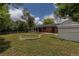 Spacious backyard with large deck and brick fire pit at 6176 Ammons St, Arvada, CO 80004