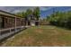 Backyard showing a covered patio, storage shed and a decorative circular stone feature at 6176 Ammons St, Arvada, CO 80004