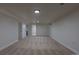 Finished basement has neutral carpeting, recessed lighting, and convenient door to another room at 6176 Ammons St, Arvada, CO 80004