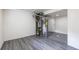 Basement with updated laminate flooring features a modern furnace and hot water heater at 6176 Ammons St, Arvada, CO 80004