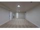 Spacious finished basement features neutral carpeting, bright recessed lighting, and ample room at 6176 Ammons St, Arvada, CO 80004