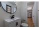 Modern bathroom featuring a stylish sink vanity, black faucet, and updated fixtures at 6176 Ammons St, Arvada, CO 80004