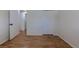 Bright bedroom featuring hardwood floors, white trim and closets offering ample storage space at 6176 Ammons St, Arvada, CO 80004