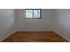 Bedroom with hardwood flooring and a window for natural light at 6176 Ammons St, Arvada, CO 80004