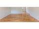 Spacious living room with gleaming hardwood floors throughout at 6176 Ammons St, Arvada, CO 80004