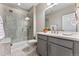 Modern bathroom featuring a glass-enclosed shower, sleek vanity, and neutral color palette at 17860 Calendula Dr, Parker, CO 80134