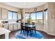 Bright dining area features large windows that offer views of the surrounding neighborhood at 17860 Calendula Dr, Parker, CO 80134