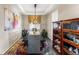 Formal dining room with elegant lighting, stylish furnishings, and room for entertaining at 17860 Calendula Dr, Parker, CO 80134