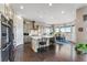 A spacious kitchen featuring a large island, stainless steel appliances and hardwood floors at 17860 Calendula Dr, Parker, CO 80134