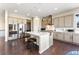 Modern kitchen featuring stainless steel appliances, a center island, and updated fixtures at 17860 Calendula Dr, Parker, CO 80134