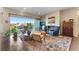 Cozy living room with a fireplace, stylish furniture, and sliding glass doors to the balcony at 17860 Calendula Dr, Parker, CO 80134