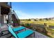 Relaxing outdoor patio featuring comfortable lounge chairs and scenic views of the surrounding neighborhood at 17860 Calendula Dr, Parker, CO 80134