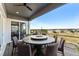 Outdoor patio featuring a round table with a fire pit, offering a cozy spot for gathering and outdoor dining at 17860 Calendula Dr, Parker, CO 80134