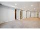 Finished basement offers ample space, access to stairs, and storage closets at 4780 E Montana Pl, Denver, CO 80222