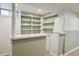 Finished basement area with shelving and wainscotting at 4780 E Montana Pl, Denver, CO 80222